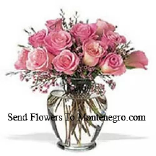 Bunch Of 11 Pink Roses With Some Ferns In A Vase