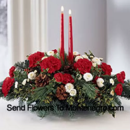 Share the joy this season with a festive fresh arrangement of red carnations and white pompons, winter greens and pinecones. Two red taper candles add seasonal charm to this centerpiece. (Please Note That We Reserve The Right To Substitute Any Product With A Suitable Product Of Equal Value In Case Of Non-Availability Of A Certain Product)